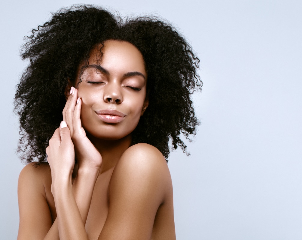 Woman with glowing, smooth skin representing results from a HALO glow laser treatment in Seattle.