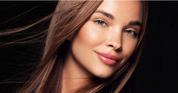 Beautiful model woman with shiny and straight long hair.