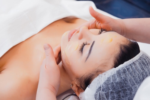 Close up of young woman getting spa massage treatment at beauty spa salon